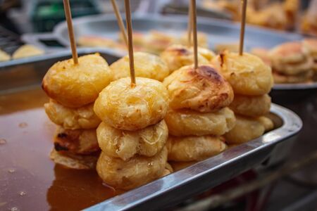 Grilled sweet potato, thai dessert in tradition in Thailand.の写真素材