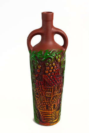 Clay bottle with ornament on a white backgroundの写真素材