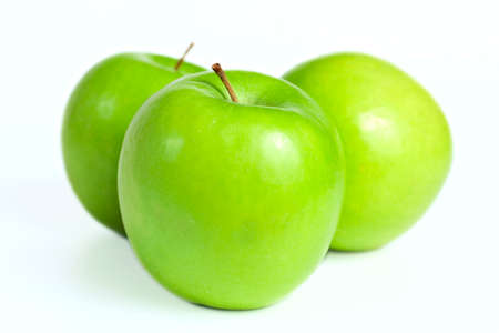 ripe fresh green apples on white backgroundの写真素材