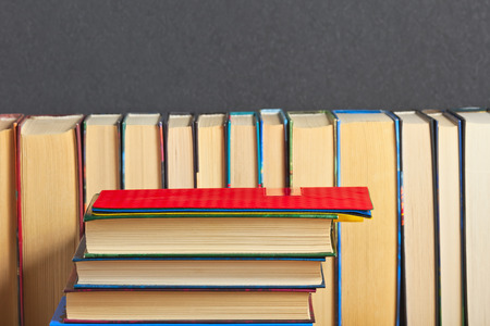 Pile of books on a wooden surfaceの写真素材
