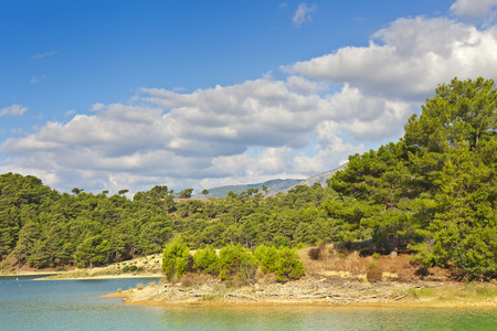 View of the coast and the mountains from the water side.の写真素材