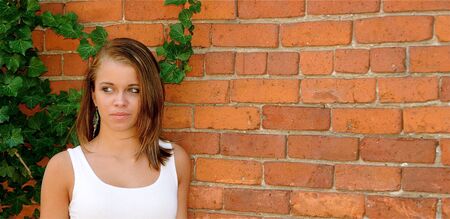 Teen posing for photographs on a sunny day. の写真素材