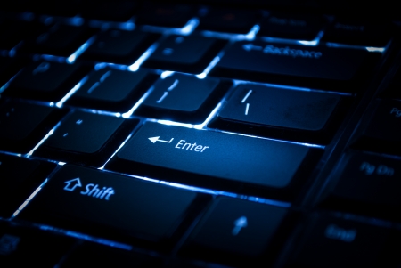 blue backlit keypad for computer and laptop with focus on enter
