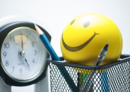 smiley ball  and table clock の写真素材