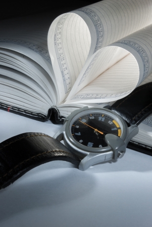 pages of a book curved into a heart shapeの写真素材