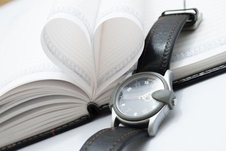 pages of a book curved into a heart shapeの写真素材