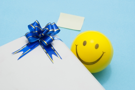 gift  box smiley and a note slipの写真素材