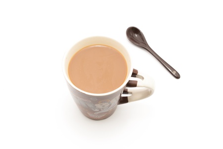 a coffee mug full of coffee with milk and sppon for mixing on white isolated backgroundの写真素材