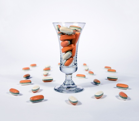 Orange tablets - pills in a glass の写真素材