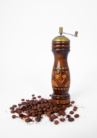 Vintage coffee grinder with coffee beans on white backgroundの写真素材