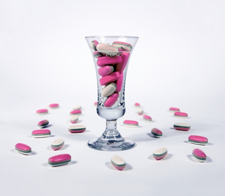 Pink tablets - pills in a glassの写真素材