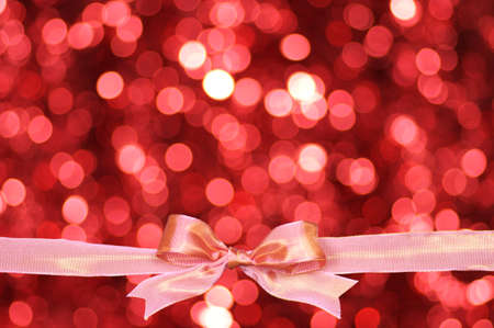 Pink ribbon and blurry pattern background.の写真素材