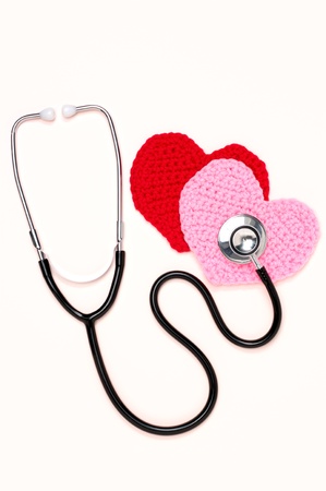 Stethoscope and knitted hearts  vertical の写真素材