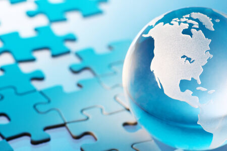 Glass globe and unfinished puzzle Closeup of glass globe  Showing Americas の写真素材