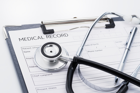 Stethoscope and medical record on white background. Result of medical... Concept image of medical care.の写真素材