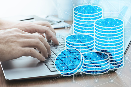 Using laptop for dealing virtual currency.
Laptop and money icon.の写真素材