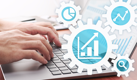 Business analytics concept. Businessman analyzing data.Laptop and many graphs.