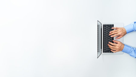 Top view of businessman using laptop. Laptop with blank display.  White background.の写真素材