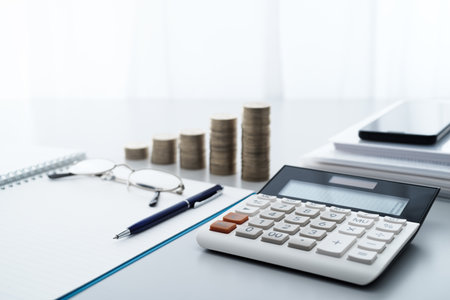 Household finance management and saving money. Calculator and stacking money.の写真素材