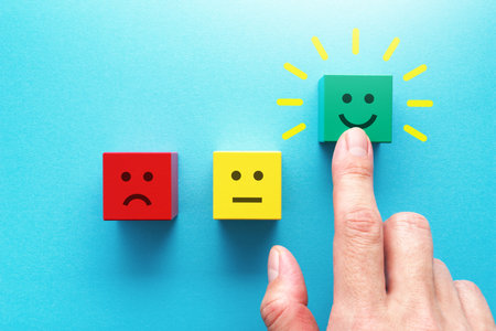 Selecting happy face block. Positive customer review.の写真素材