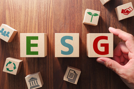 The word "ESG". Issue of ESG. Putting wood cubes with alphabets and icons. Top view of wood table.の写真素材