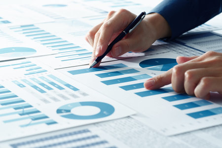 Business analysis. Consultant thinking of management strategy. Closeup of analyst's hands pointing...