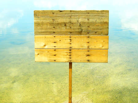 wooden sign board on the riverの写真素材
