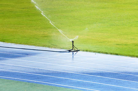 Sprinkler on the playfieldの写真素材