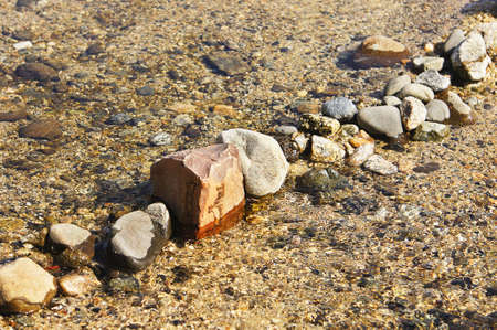 Hand made weir on the riverの写真素材