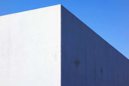 The corner of the wall with blue skyの写真素材