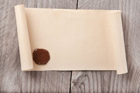 old paper on wood backgroundの写真素材