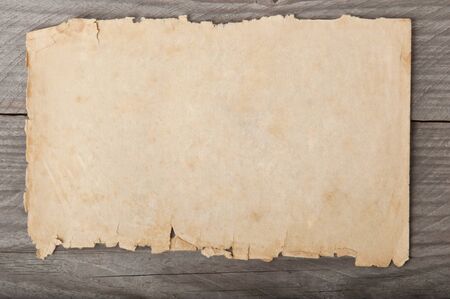 old paper on wood backgroundの写真素材