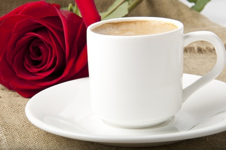 a rose and a cup of coffeeの写真素材
