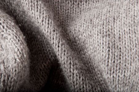 abstract gray background with a knitted fabric