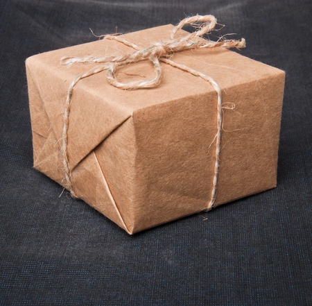 gift on background of dark fabricの写真素材