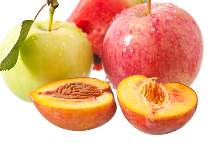 apple, peach and watermelon on a white backgroundの写真素材