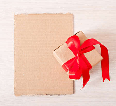 gift and paper on wooden background