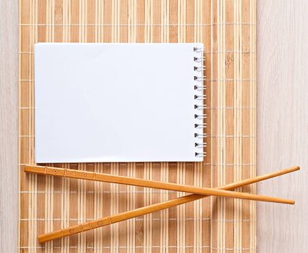 Sushi menu chopsticks for sushi on bamboo napkinの写真素材