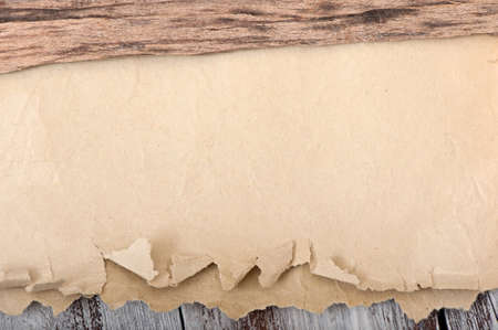 Old paper on a old wooden backgroundの写真素材