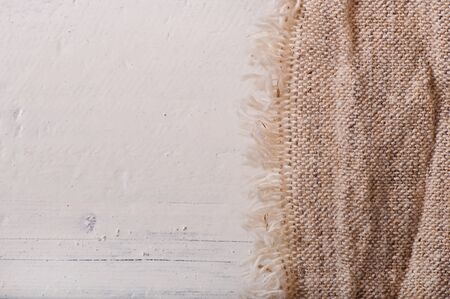 Old cloth on an old wooden background.