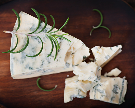 Blue cheese on the old wooden background.の写真素材