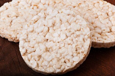 Rice diet bread on an old wooden background, diet food.
