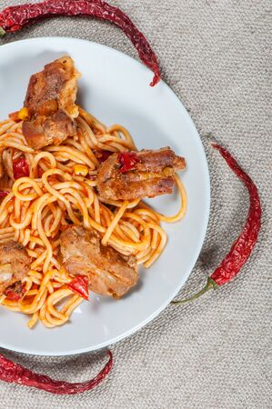 Pasta spaghetti in tomato sauce and rib meat.の写真素材