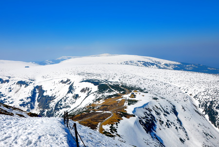 snow hills with rocks in the winter