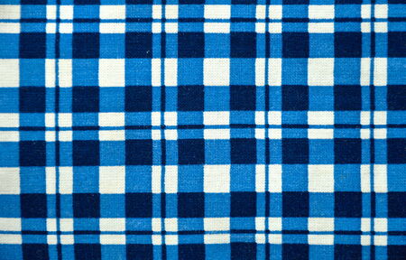 close up of blue and white square fabric 