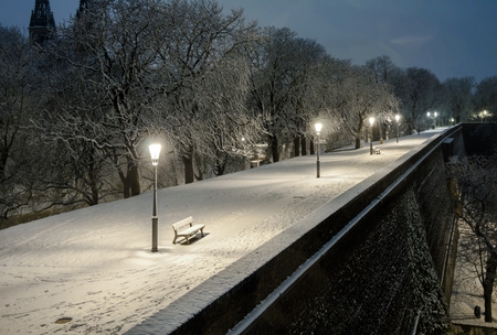 Night scenery of snowy Prague streets with bokehの写真素材