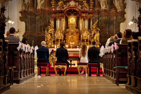 Bride and groom sitting on wedding ceremony. Christian wedding ceremony in a church.のeditorial素材