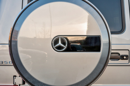 PRAGUE, THE CZECH REP., NOVEMBER 27, 2016: Closeup of new luxury car Mercedes-Benz G 350 d parking in front of car store. Detail of rear view of carのeditorial素材