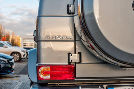 PRAGUE, THE CZECH REP., NOVEMBER 27, 2016: Closeup of new luxury car Mercedes-Benz G 350 d parking in front of car store. Detail of rear view of carのeditorial素材