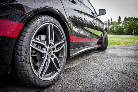 PRAGUE,THE CZECH REPUBLIC, 31.8.2017: Closeup of Mercedes Benz CLA 45 AMG, black car with red sports...
